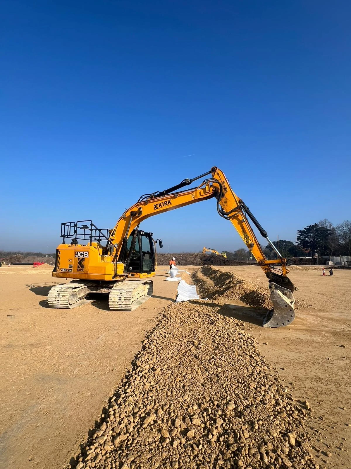 Kirk excavator carrying out groundworks on a construction site